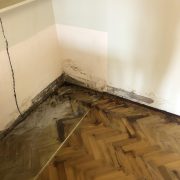 Kleenit - Wall and wooden floor damaged by flooding