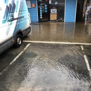 Kleenit van parked outside flooded business